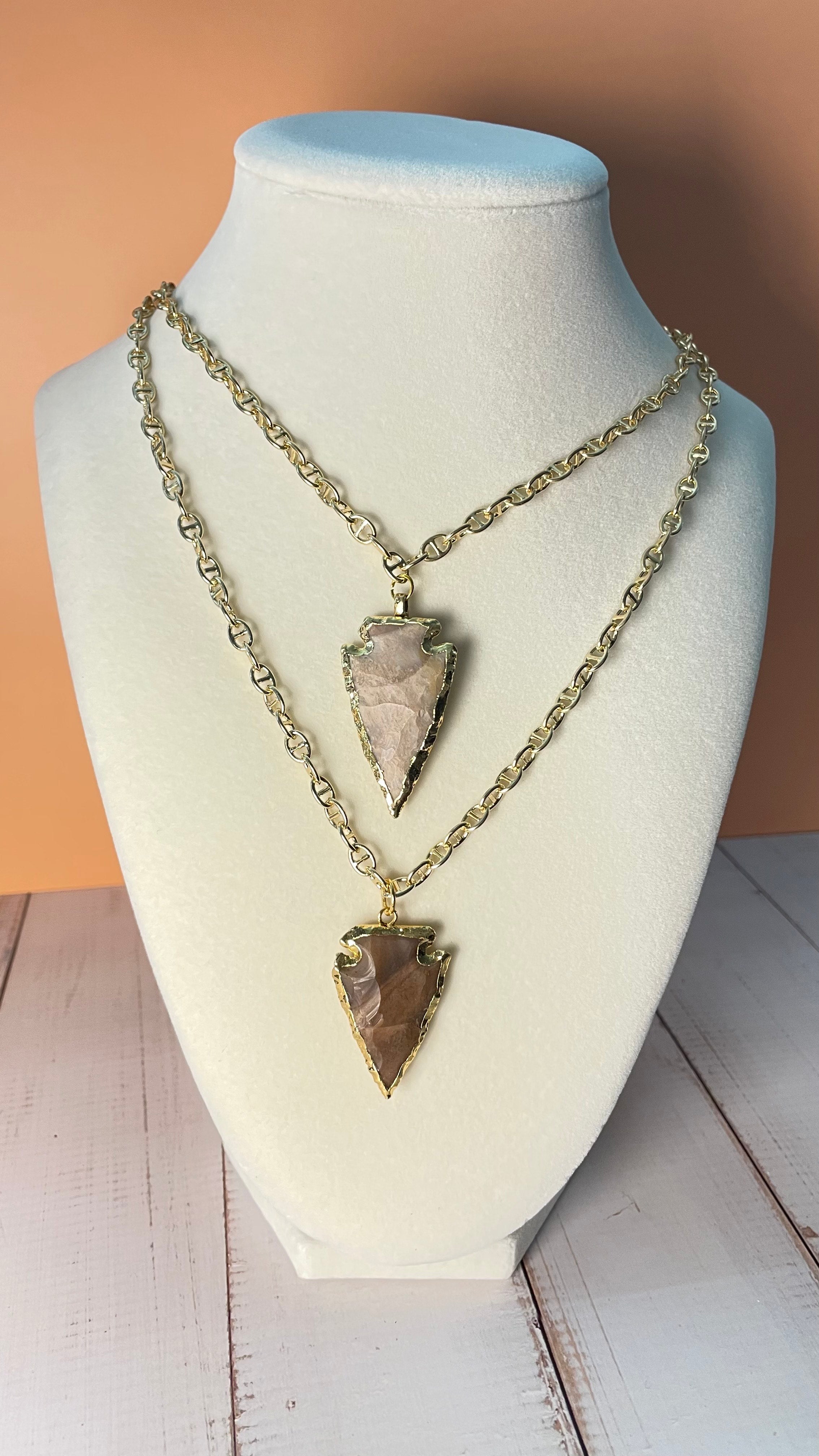Two Chert Arrowhead Necklaces displayed on a mannequin bust