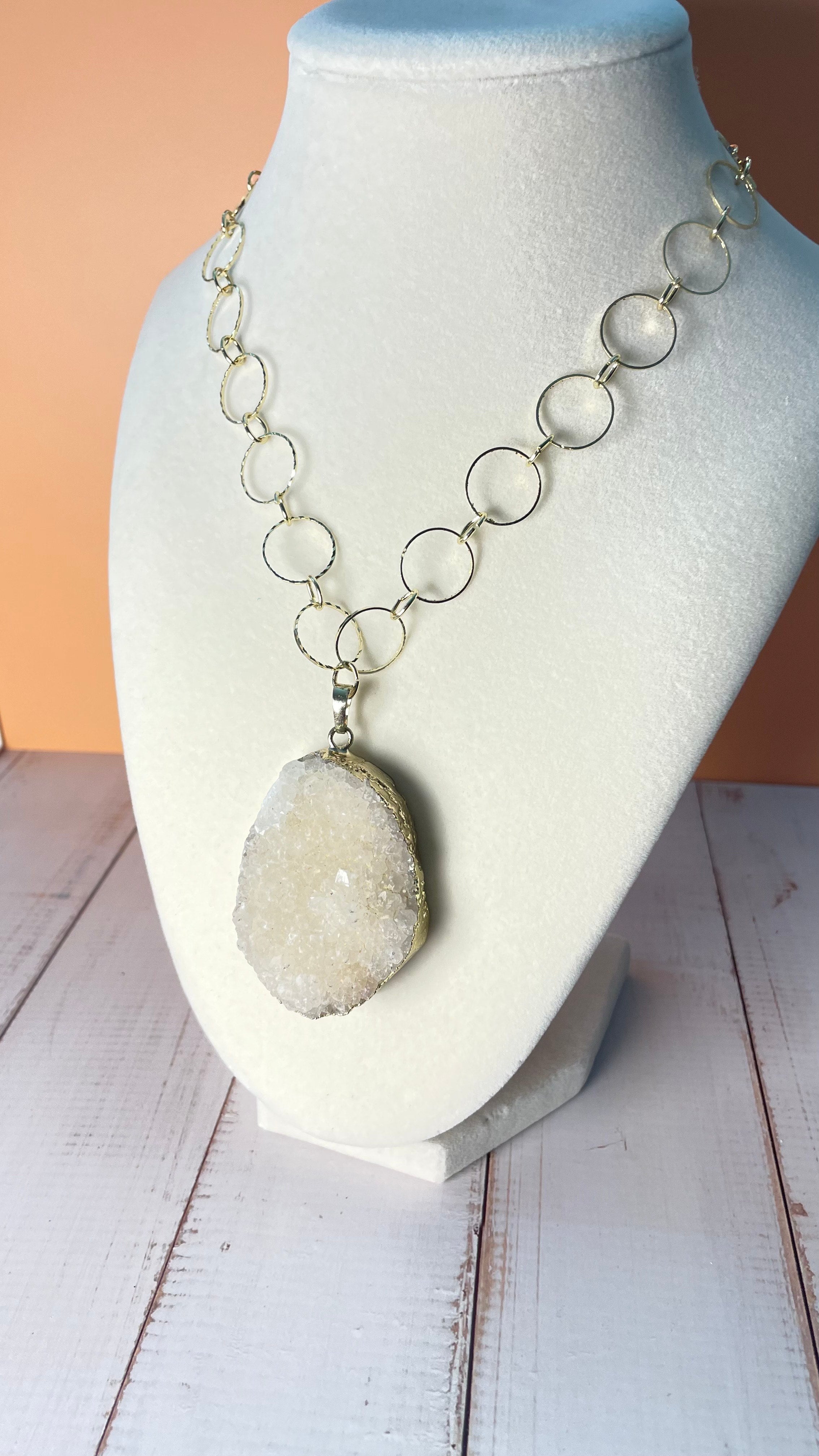 Large Calcite Cluster Pendant Gold Chain Link Necklace shown on mannequin display bust